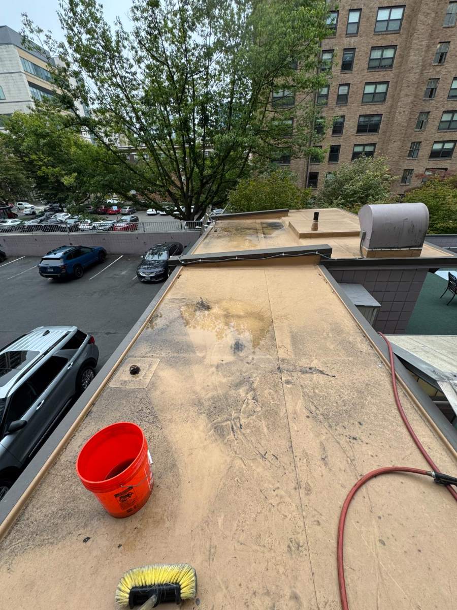 Long flat surface section with weathered staining before cleaning